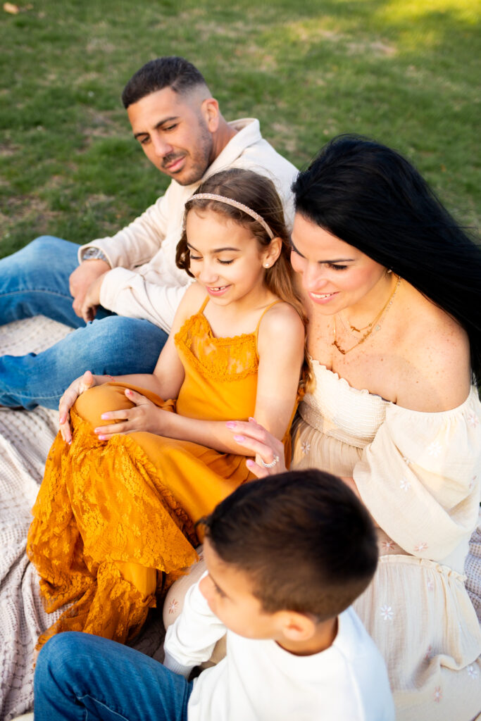 mother father daughter son during family photoshoot on long island